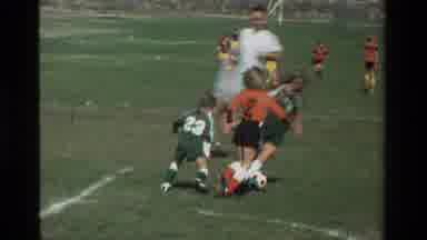California USA (1981): Little Kids Attempting To Play Soccer On A Green Field On A