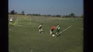 California USA (1981): Elementary School Aged Children Playing Soccer In The Park
