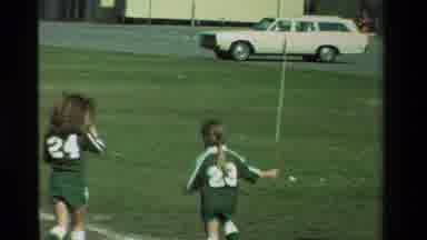 California USA (1981): Young Girls And Boys Playing Soccer In Green And Orange