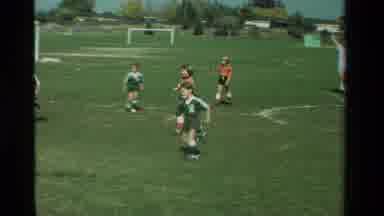 California USA (1981): Little Soccer Star Goes For A Goal While Her Teammates Look