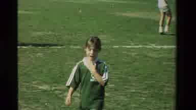 California USA (1981): Girl In Green Uniform Running And Playing Soccer Gets Out