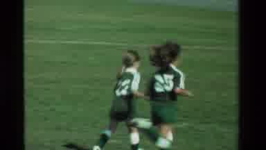 California USA (1981): Young Girls Playing A Soccer Game Outdoors On A Sunny Day