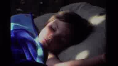 CALIFORNIA USA-1981: Young Boy Sleeping Peacefully During The Sunrise In The
