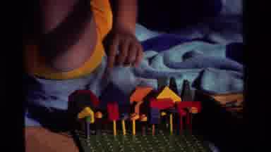 California USA (1981): A Child Playing A Board Game Outside On A Camping Trip