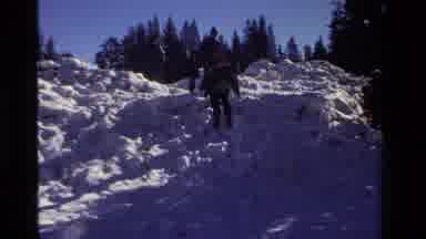 California USA (1981): Child Sledding Through Snow And Person Walking Down Huge