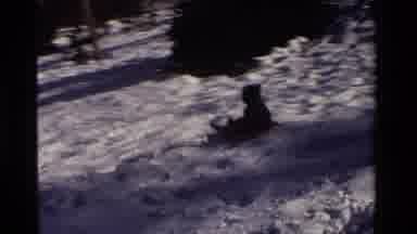 California USA (1981): Little Kid Sledding Down A Big Hill And Having The Time Of