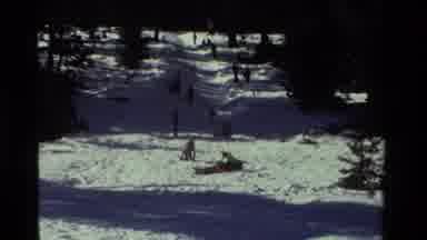 California USA (1981): Parents Send Bundled Up Children Sledding Down Large Snowy