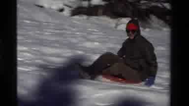 California USA (1981): A Boy Is Skating In The Snow Slope And Enjoying The Winter