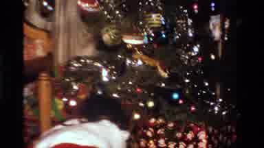 California USA (1984): Girl Getting Presents From Under Christmas Tree