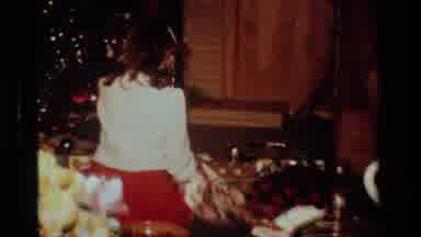 California USA (1984): Little Girl Finding Her Presents Under The Tree And Opening