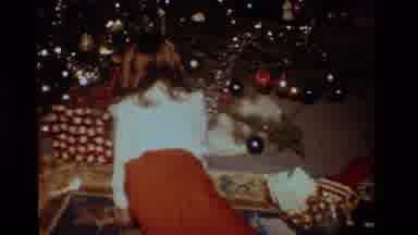 California USA (1984): Small Girl Opening Gifts On Christmas