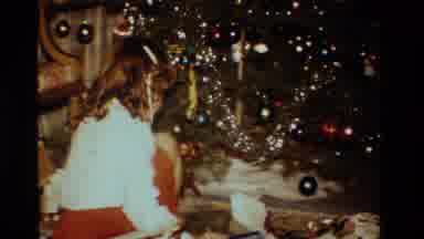 California USA (1984): Child Lifting And Displaying Books To Someone Off To The