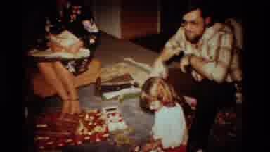 California USA (1984): Little Girl And Parents Opening Presents On Christmas