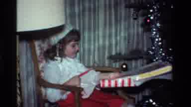 California USA (1984): The Joy Of A Child Receiving His Beautiful Christmas Gift