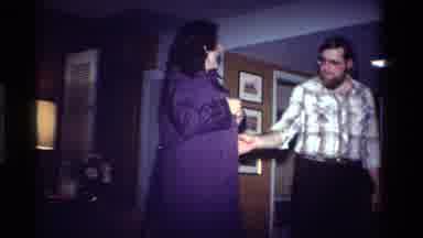 California USA (1984): Man Stares Confusingly At Woman's Id Badge On Arm