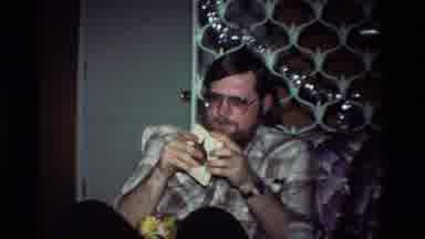 California USA (1984): A Man Looking At A Box And A Child Showing A Red Box To Him