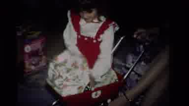 California USA (1984): Young Girl Playing With Toys And A Stroller