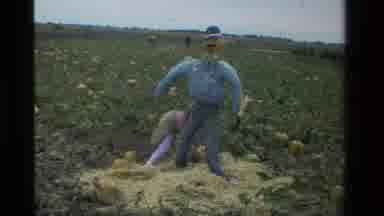 California USA (1984): Life Sized Dressed Scarecrow Man Young Girl Behind Holding