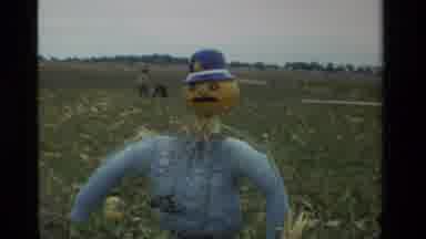 California USA (1984): Scarecrow With Pumpkin Head And Little Girl Carrying