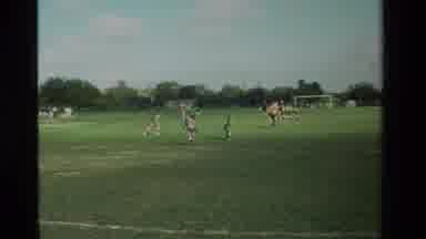 California USA (1984): Middle School Children Practicing Soccer On A Green Grass