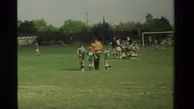 California USA (1984): Girls Kid Soccer Team Game On Field With Coach And Referee