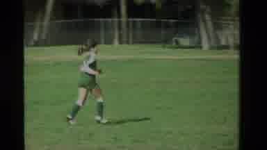 California USA (1984): A Small Girl With A Green Top Running And Playing Soccer