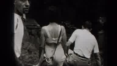 New York USA-1938: A Group Of People Hiking And Walking In A Cave