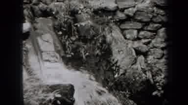 New York USA (1938): Images Of Water Streaming Into A Body Of Water As People