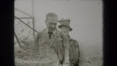 New York USA (1938): Two Men A Woman And A Tree Stand Outside In The Woods