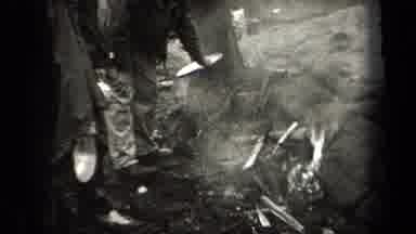 New York USA (1938): Chicken Ready To Roast Hangs While Crew Attempts To Start A