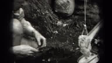 New York USA (1938): A Man Camping Out In The Woods And Cooking His Turkeys
