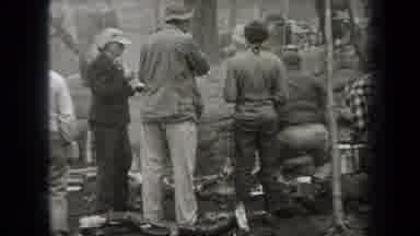 New York USA (1938): There Are Several Adults Cooking And Eating A Meal Outdoors