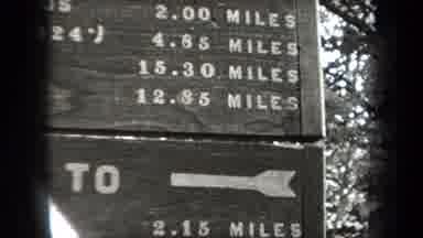 New York USA (1938): A Wooden Directional Set In The Woods Showing How Long It