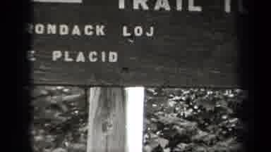 NEW YORK USA-1938: Family Hiking Trip In The Adirondacks With Trail Sign To Lake Placid