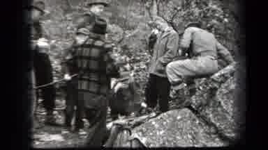 New York USA (1938): 5 People Around A Campfire Smoking And Cooking Food