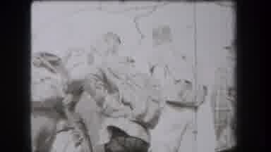 New York USA (1938): A Big Group Of People With Backpacks On Walking Through A