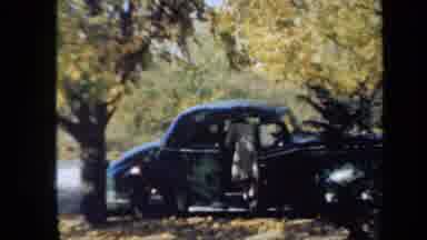 New York USA (1939): Women In Dress Getting Out Of An Old Time Automobile