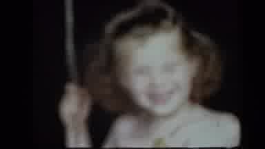 New York USA (1939): Smiling Child Enjoying Swing While Two Other Children Enjoy A