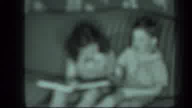 New York USA (1939): Very Blurry Video Of Two Children Reading A Book On A Couch