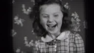 New York USA (1939): Happy Little Girl Laughing While Her Beautiful Curls Bounce