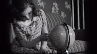New York USA (1939): The Child Rolls The Globe In Her House For A Game