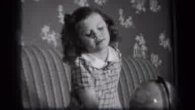 New York USA (1939): Little Girl With Curls Playing And Looking At Globe And