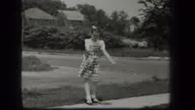 New York USA (1939): Boy Riding On Tricycle Girl Playing Small Rubber Ball