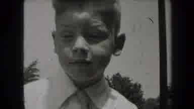 New York USA (1939): Young Boy In Shirt And Tie On Camera Smiling For An Apparent
