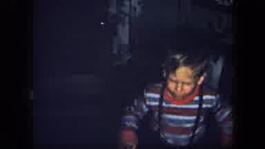 New York USA-1958: Boy In Red White And Gray Striped Sweater Exploring House