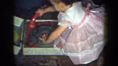 New York USA (1958): A Little Little Girl Has Fun Playing With An Old Record