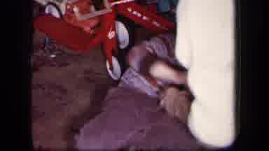 New York USA (1958): A Mother Picks Up Her Child As He Smiles And Plays