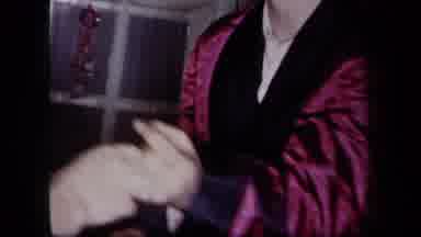 New York USA (1958): Man In Maroon And Black Robe Dancing With Woman Near Window
