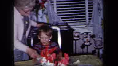 New York USA (1958): A Sweet Grandmother Helps Her Grandchild Flip Through A