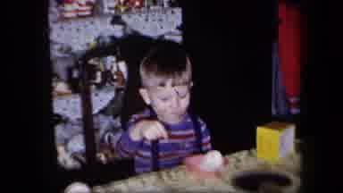New York USA (1958): Boy In Suspenders Uses Spoon To Eat Ice Cream At Dinner Table